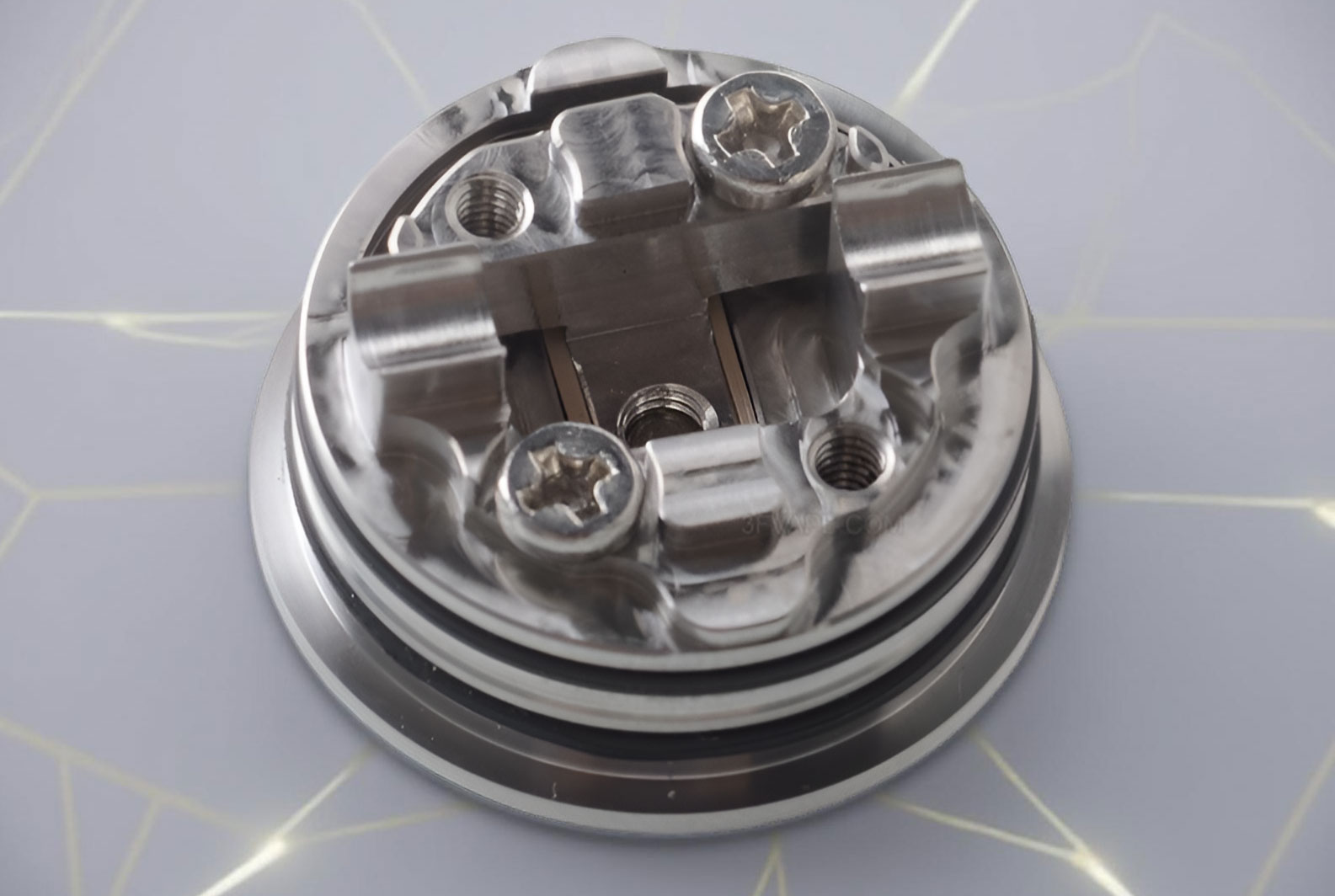 Close-up view of the Auguse Era RTA V3's elevated two-post build deck, optimized for single coil installation and featuring a clear channel for the core air intake.