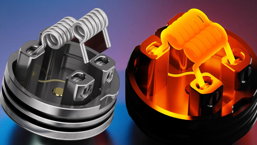 the Digiflavor DROP RDA V2 stainless-steel build deck. Two large, multi-strand Fused Clapton coils are installed vertically into the four gold-plated posts. The coil leads are trimmed flush, and the coils are centered over the deep juice well, showcasing the clean and spacious layout.