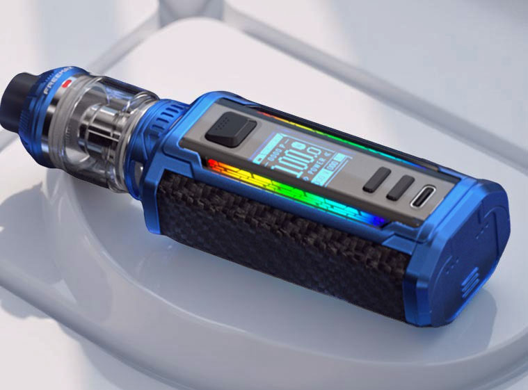 Close-up of the Freemax Maxus 3 Kit control face, displaying the large color screen, the fire button, separate adjustment buttons, and the USB-C charging port. The image also highlights the customizable full-spectrum RGB lighting integrated around the display.