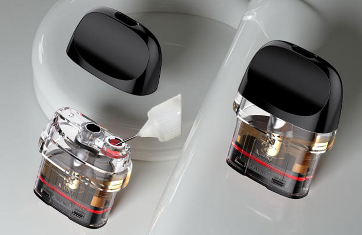 the top-fill method of the SMOK Novo 5 Meshed 0.7-ohm pod. The black whistle-shaped mouthpiece is snapped off to the side, revealing the red silicone-sealed filling port on top of the 2ml clear reservoir. A juice bottle tip is shown inserted into the port, illustrating how the pod remains securely seated in the device during a refill.