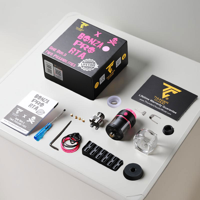 Image showing all included contents of the Bonza Pro RTA set: the RTA, bubble glass, extra coils, coil trimmer tool, 510 stand, spare parts, and the lifetime warranty card.