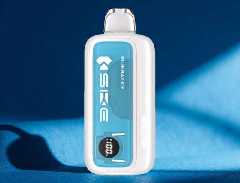 Close-up of the SKE V-BOT Blue Razz Ice disposable vape highlighting the vibrant blue casing and the bright, integrated smart digital screen showing battery and e-liquid levels.