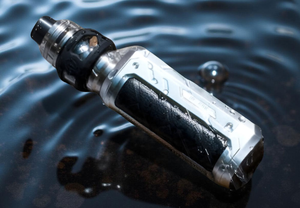 A Vaporesso Armour Ultra vape kit resting on its side at the bottom of a clear body of water. Bubbles surround the heavy-duty TPU chassis, highlighting the device's IP68 waterproof and dustproof resilience while submerged.