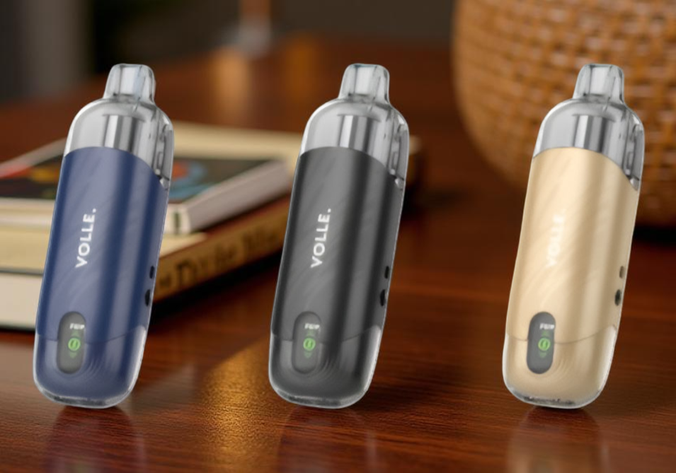 A sleek lineup of three SMOK Volle Pod Systems displayed from left to right in Dark Blue, Black, and Champagne Gold, showcasing their rugged zinc-alloy chassis and the large 10mL transparent pods.