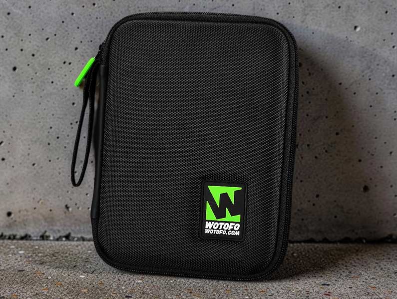 A black waterproof fabric zipper hard case for the Wotofo Vape Tool Kit featuring a vibrant lime green Wotofo logo centered on the front.