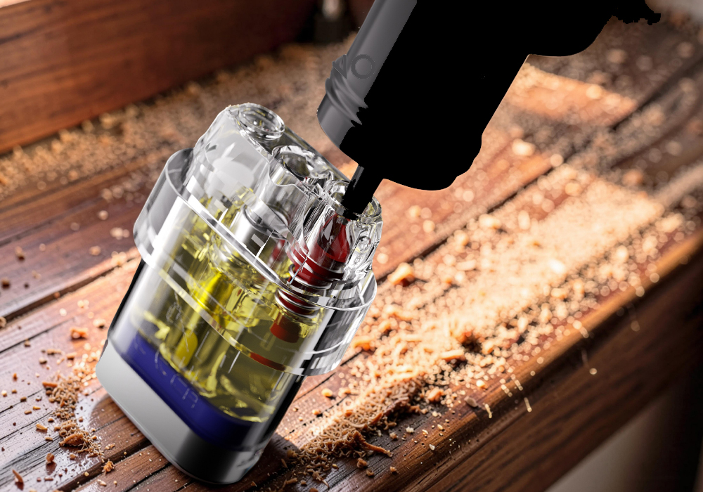 Close-up of a needle-nose e-liquid bottle refilling a transparent SMOK Novo Axis EZ pod cartridge, clearly showing the internal spring-loaded valve mechanism that prevents spills.